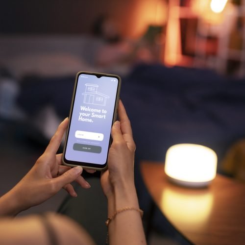 high-angle-hands-holding-smartphone